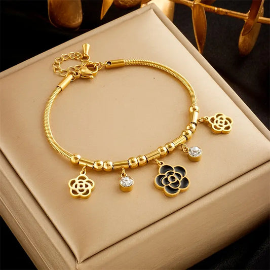 Vintage-style stainless steel bracelet with flower pendants