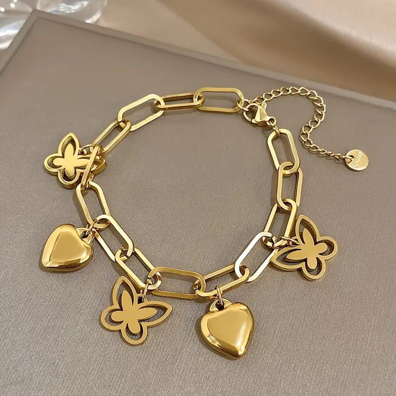 Elegant bracelet with butterfly and heart-shaped pendants