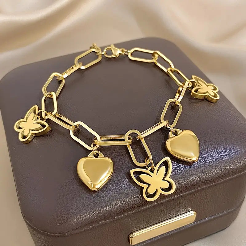 Elegant bracelet with butterfly and heart-shaped pendants