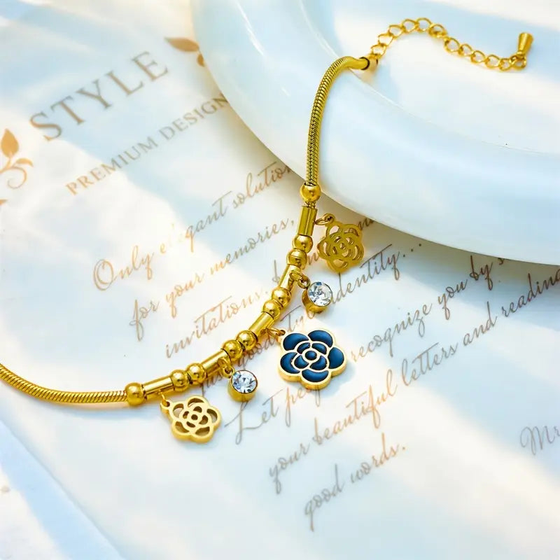 Vintage-style stainless steel bracelet with flower pendants
